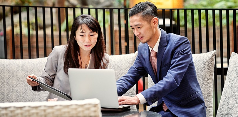 Two people working out a campaign plan